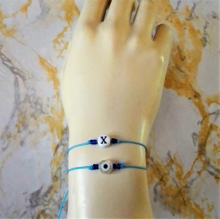 SET C144β.Σετ παιδικό γαλάζια βραχιόλια μονόγραμμα Χ και ματάκι