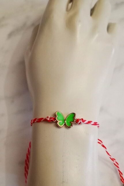 Μαρτάκι παιδικό με πεταλούδα σε πράσινο ανοιχτό