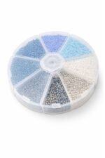 Round plastic wheel organizer with 7 sections of blue, white and clear seed beads.